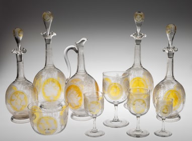SANDWICH LATE BLOWN, AMBER/SILVER NITRATE STAINED, AND ENGRAVED 44-PIECE BEVERAGE / DECANTER SET
