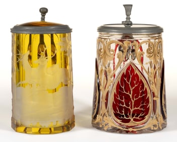 STAINED AND DECORATED GLASS STEINS, LOT OF TWO