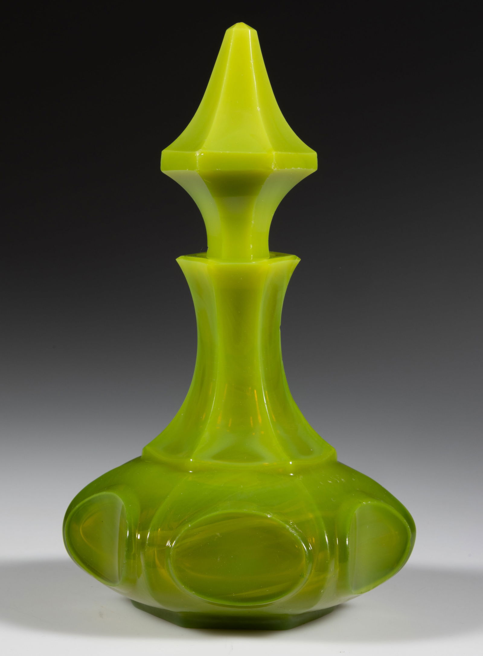 BLOWN-MOLDED PANELLED HORIZONTAL OVALS COLOGNE BOTTLE: BLOWN-MOLDED PANELLED HORIZONTAL OVALS COLOGNE BOTTLE, unusual translucent opalescent jade green, large-size hexagonal form with panel-cut neck, factory polished mouth, ovals, table ring, and pon