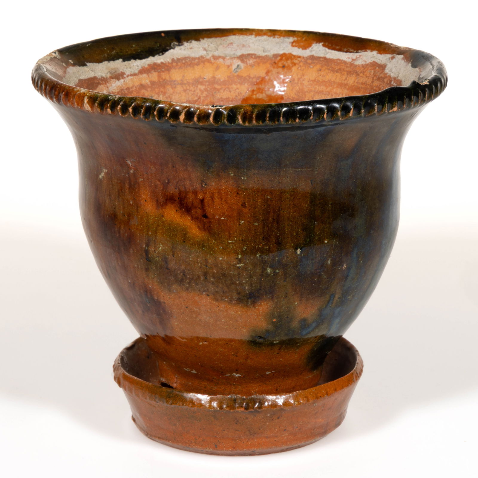 STRASBURG, SHENANDOAH VALLEY OF VIRGINIA POLYCHROME-DECORATED EARTHENWARE / REDWARE FLOWER POT: STRASBURG, SHENANDOAH VALLEY OF VIRGINIA POLYCHROME-DECORATED EARTHENWARE / REDWARE FLOWER POT, lead-, copper-, and manganese-glazed, urn form with pie-crimped rim, punched drain hole to side of