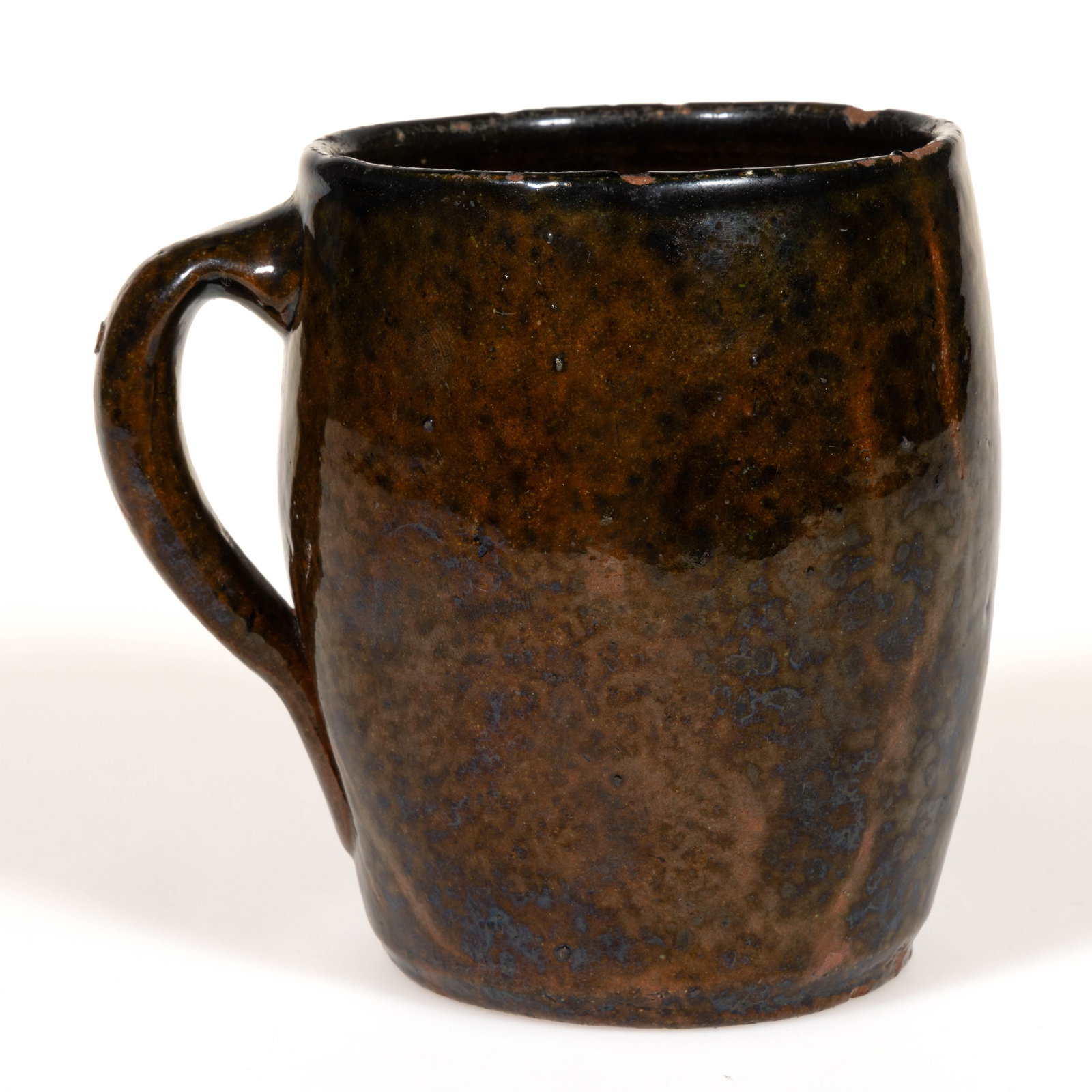 STRASBURG, SHENANDOAH VALLEY OF VIRGINIA DECORATED EARTHENWARE / REDWARE MUG: STRASBURG, SHENANDOAH VALLEY OF VIRGINIA DECORATED EARTHENWARE / REDWARE MUG, lead- and manganese-glazed with light copper flecks, barrel form with applied strap handle. Probably Jacob Eberly (1830-19