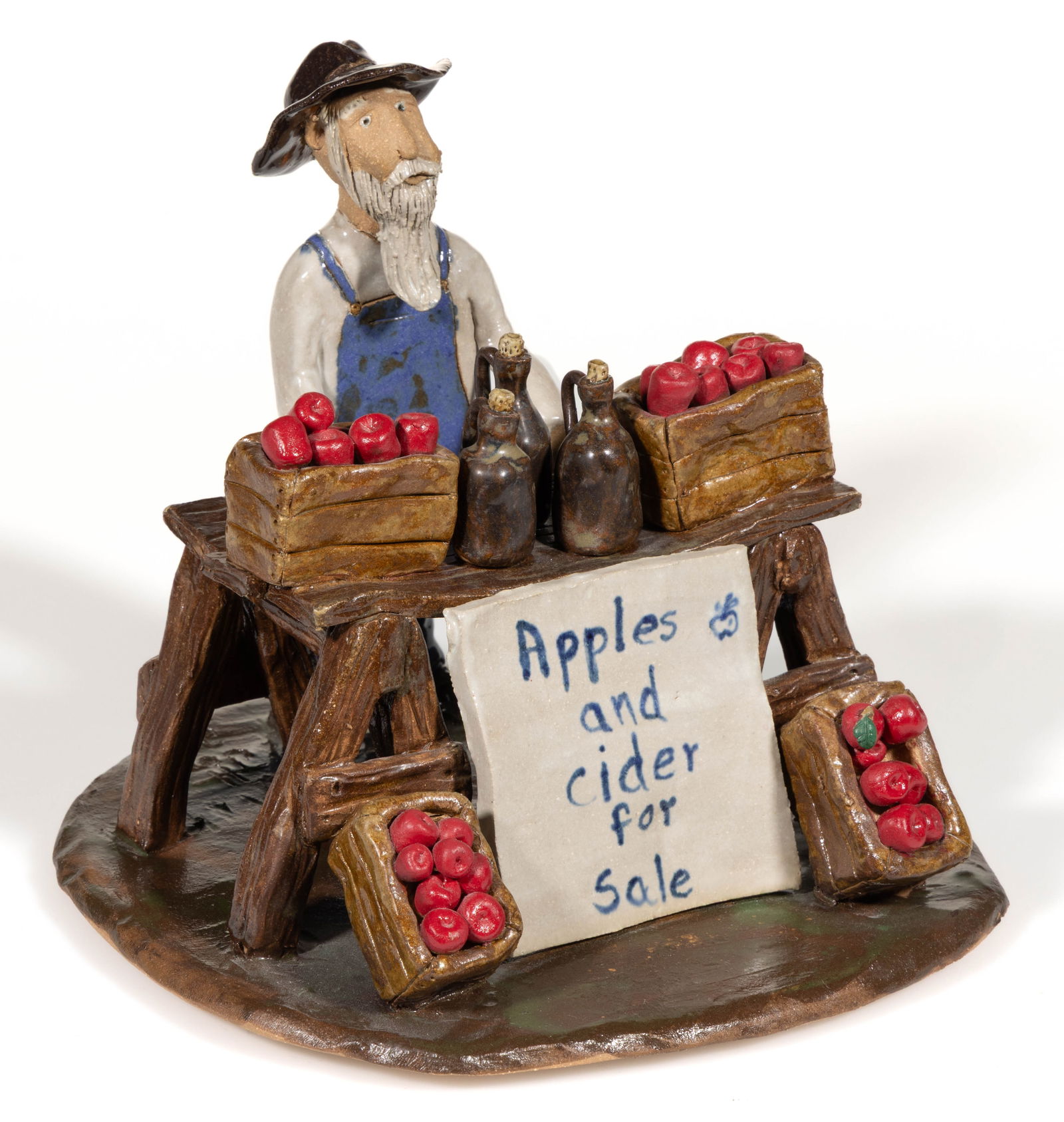 SIGNED "CRYSTAL KING / SEAGROVE NC", NORTH CAROLINA EARTHENWARE / REDWARE LION FIGURE: SIGNED "CRYSTAL KING / SEAGROVE NC", NORTH CAROLINA EARTHENWARE / REDWARE LION FIGURE, depicting a standing wildcat with tail curled onto back, applied curly brown mane, and a grinning