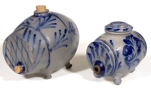 GERMAN DECORATED STONEWARE "BLIND PIGS" / FOOTED KEGS, LOT OF TWO