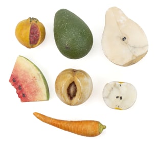 ASSORTED FOLK ART CARVED AND PAINTED FIGURAL STONE FRUIT, LOT OF SEVEN