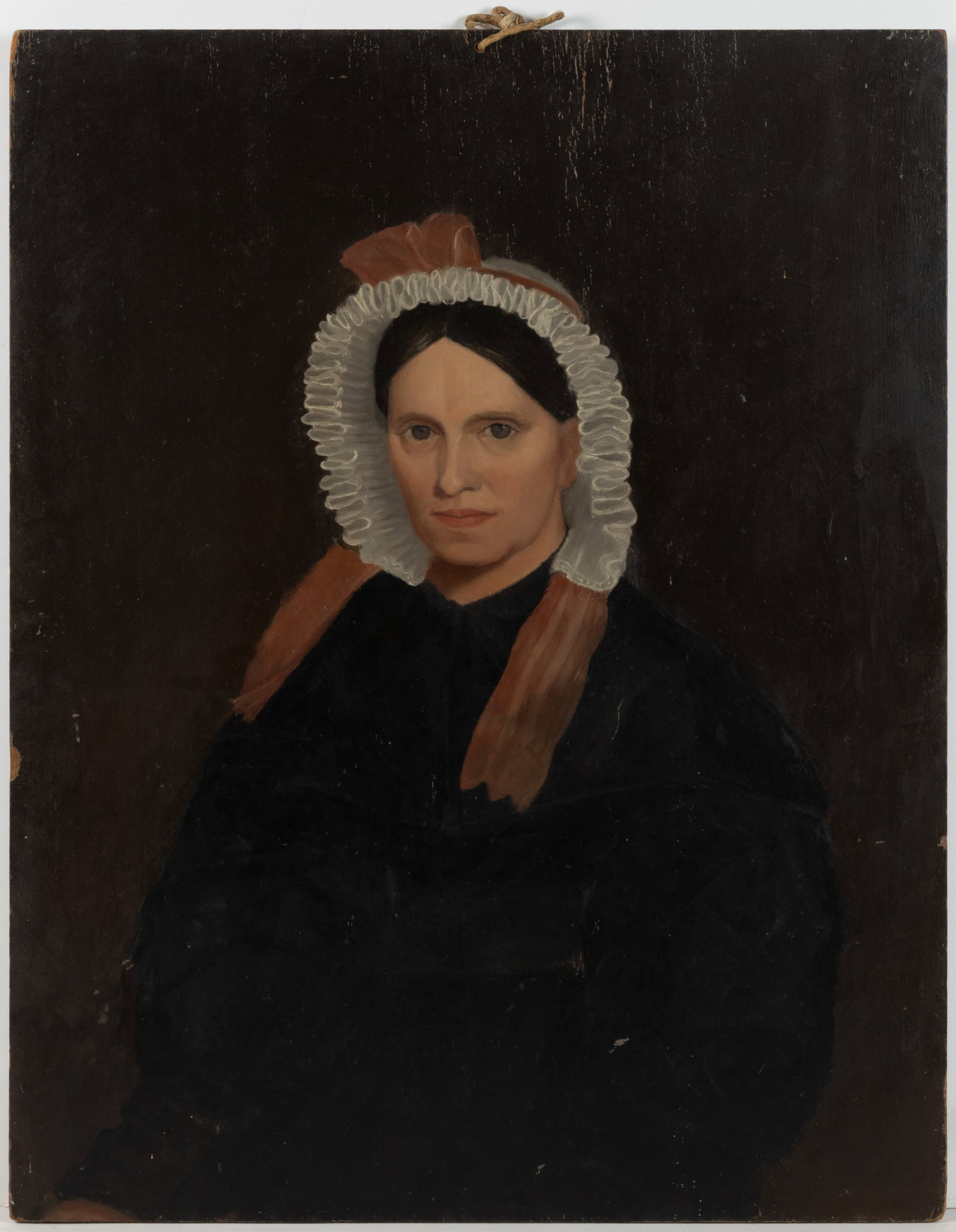 AMERICAN SCHOOL (19TH CENTURY) FOLK ART PORTRAIT OF A WOMAN: AMERICAN SCHOOL (19TH CENTURY) FOLK ART PORTRAIT OF A WOMAN, oil on panel, waist-length depiction of sitter wearing black dress and white bonnet with pink ribbon, retaining period, possibly original, 