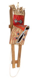 NATIVE AMERICAN PLAINS INDIAN U.S. FLAG PICTORIAL QUILLED AND BEADED HIDE CRADLEBOARD COVER / HOOD: NATIVE AMERICAN PLAINS INDIAN U.S. FLAG PICTORIAL QUILLED AND BEADED HIDE CRADLEBOARD COVER / HOOD, thread and sinew sewn, front edges with blue and white beading, sides with dyed quillwork