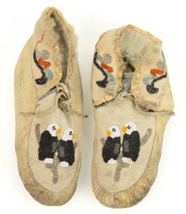NATIVE AMERICAN / CANADIAN BALD EAGLE PICTORIAL BEADED WOOL AND HIDE MOCCASINS, PAIR: NATIVE AMERICAN / CANADIAN BALD EAGLE PICTORIAL BEADED WOOL AND HIDE MOCCASINS, PAIR, thread sewn, leather soles with wool felt vamps and collars, which having polychrome beaded decoration, each