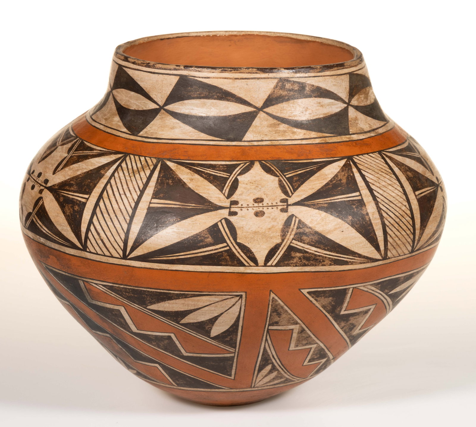NATIVE AMERICAN ACOMA PUEBLO POTTERY JAR / OLLA: NATIVE AMERICAN ACOMA PUEBLO POTTERY JAR / OLLA, shouldered form, featuring polychrome hand-painted geometric designs. Hand-brushed "ACOMA, / N. (backwards) M." to underside. Acoma Pueb