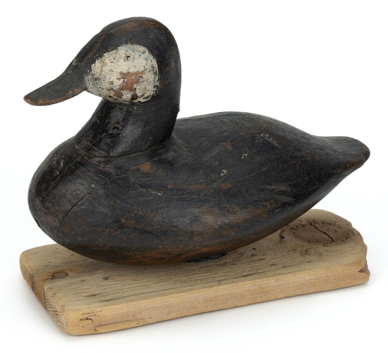 JOHN WILLIAMS (CEDAR ISLAND, NORTH CAROLINA, 1857-1937), ATTRIBUTED, CARVED AND PAINTED RUDDY DUCK: JOHN WILLIAMS (CEDAR ISLAND, NORTH CAROLINA, 1857-1937), ATTRIBUTED, CARVED AND PAINTED RUDDY DUCK DECOY, classic form retaining old painted surface, applied lead weight to underside, presented on a c