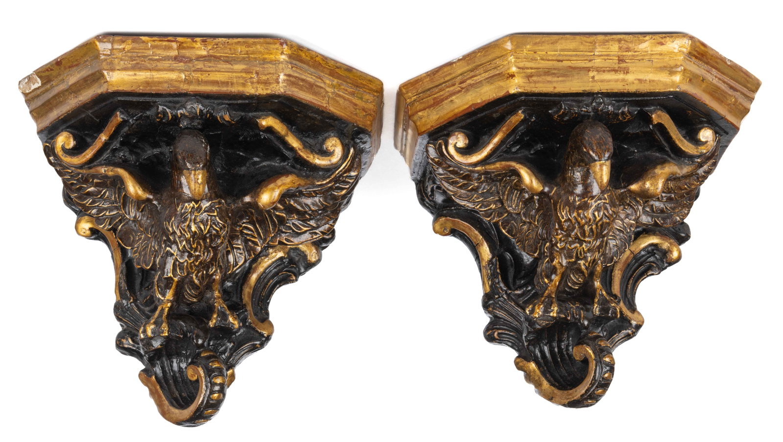 PAIR OF AMERICAN OR CONTINENTAL EAGLE PARCEL-GILT WALL SCONCES / BRACKETS: PAIR OF AMERICAN OR CONTINENTAL EAGLE PARCEL-GILT WALL SCONCES / BRACKETS, carved wood with a layer of gesso, dovetailed construction, each featuring a shaped shelf with a molded edge suppor