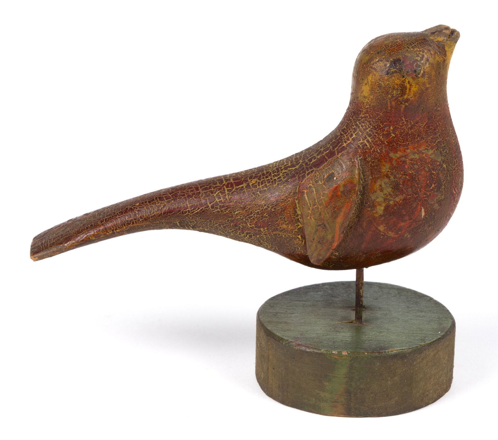 PENNSYLVANIA FOLK ART CARVED AND PAINTED PINE SONGBIRD FIGURE: PENNSYLVANIA FOLK ART CARVED AND PAINTED PINE SONGBIRD FIGURE, a singing figure with small delineated wings, long tail, and open beak, wire-nail legs attached through the circular wooden base. Retains