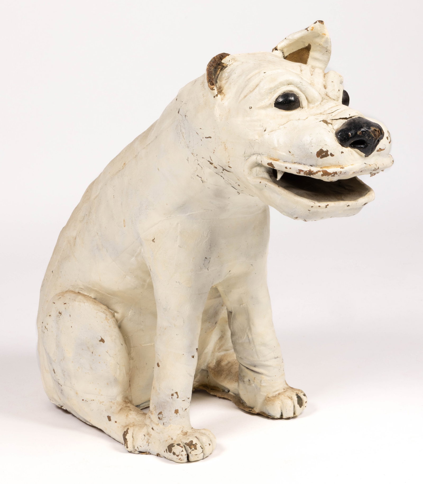 AMERICAN FOLK ART PAPIER-MACHE BULLDOG TRADE FIGURE: AMERICAN FOLK ART PAPIER-MACHE BULLDOG TRADE FIGURE, papier-mache with a wooden armature beneath, depicting a fearsome bulldog sitting on his hind legs with his mouth open ready to bite. Retains its l