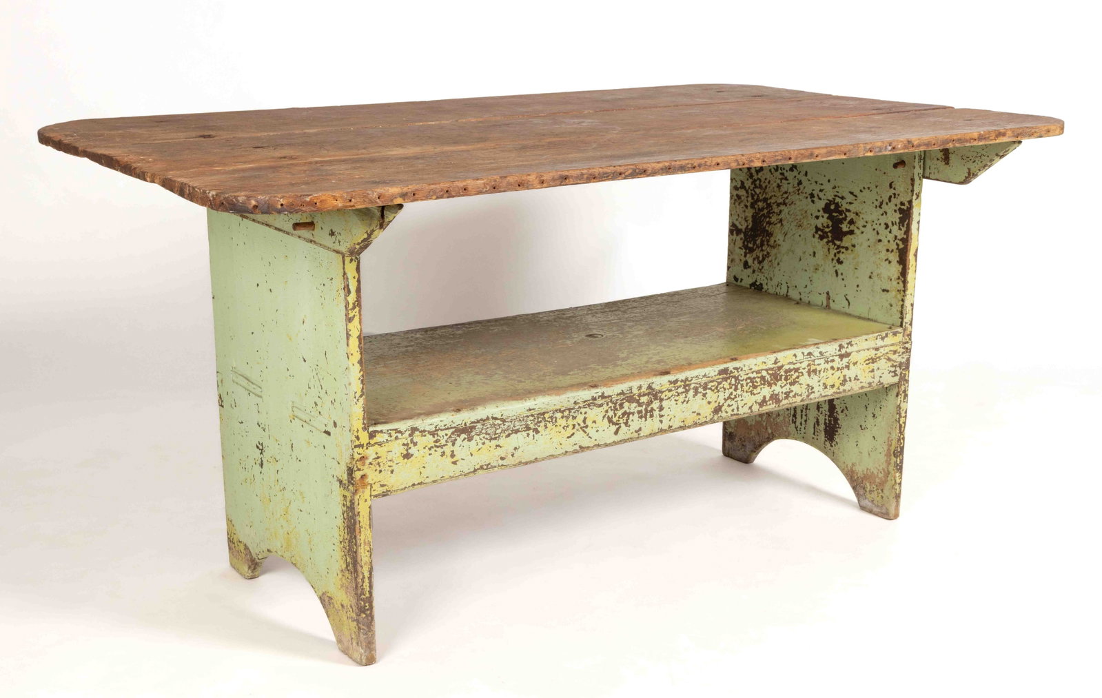 MID-ATLANTIC PAINTED POPLAR HUTCH TABLE: MID-ATLANTIC PAINTED POPLAR HUTCH TABLE, the three-board scrubbed top with applied battens to the underside raised on a bench base with a medial seat which is mortised through the solid ends which eac
