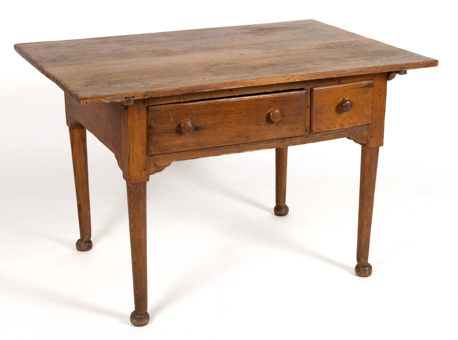 MID-ATLANTIC, PROBABLY PENNSYLVANIA, PINE WORK / TAVERN TABLE: MID-ATLANTIC, PROBABLY PENNSYLVANIA, PINE WORK / TAVERN TABLE, the rectangular overhanging top over a plain apron with shaped corner brackets the front with a larger drawer and a smaller drawer, the w