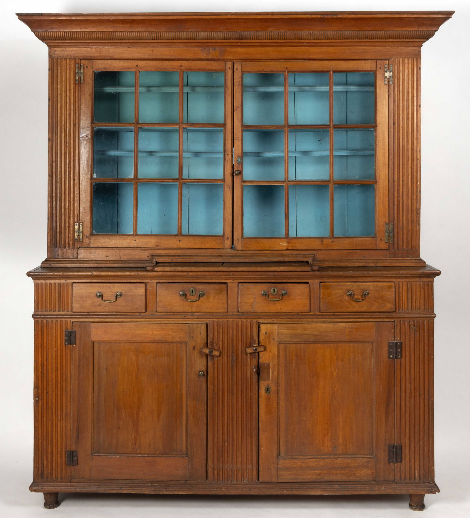 YORK CO., PENNSYLVANIA POPLAR STEP-BACK WALL "DUTCH" CUPBOARD: YORK CO., PENNSYLVANIA POPLAR STEP-BACK WALL "DUTCH" CUPBOARD, of two-piece form, the upper case featuring a robust molded cornice over two nine-pane glazed cabinet doors which conceal two f