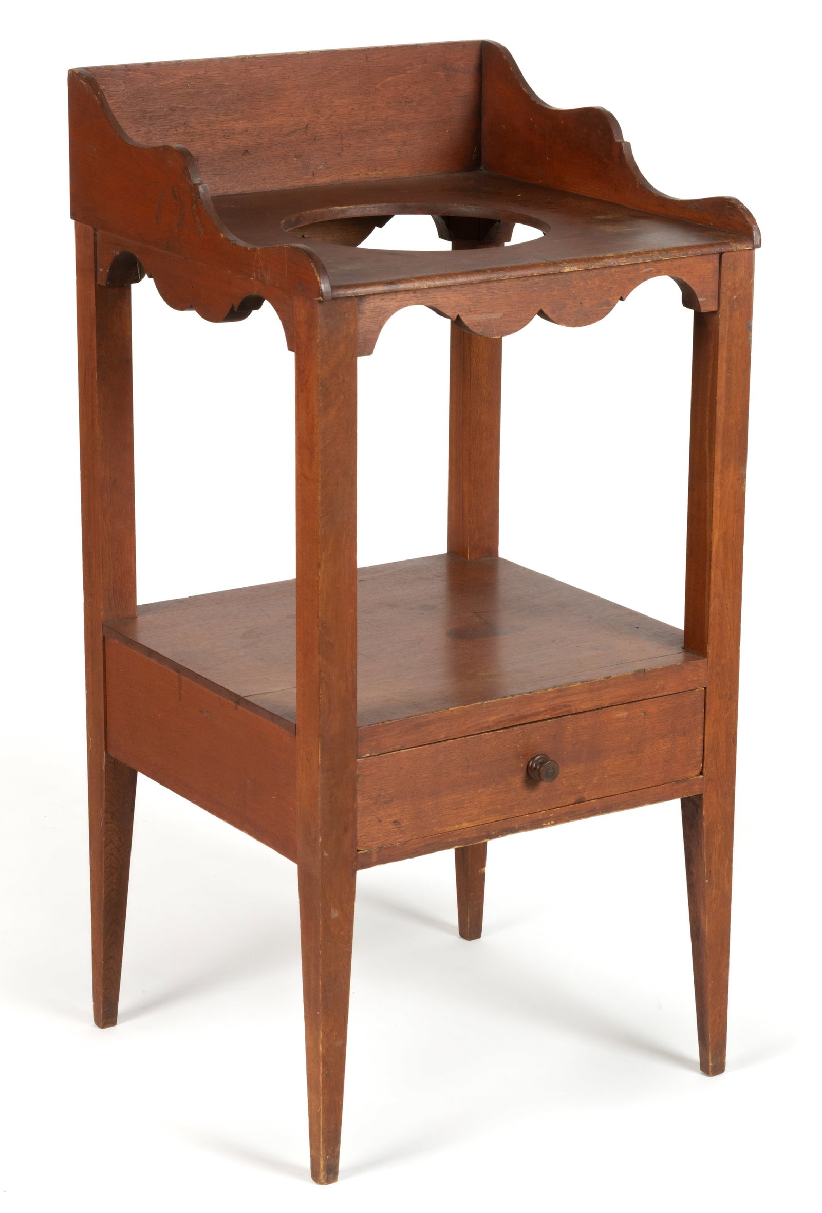 SIGNED NEW ENGLAND FEDERAL RED-WASHED BIRCH OPEN WASHSTAND: SIGNED NEW ENGLAND FEDERAL RED-WASHED BIRCH OPEN WASHSTAND, the shaped dovetailed gallery applied to the square top with a round hole in the middle to accept the wash bowl over a medial shelf with a s