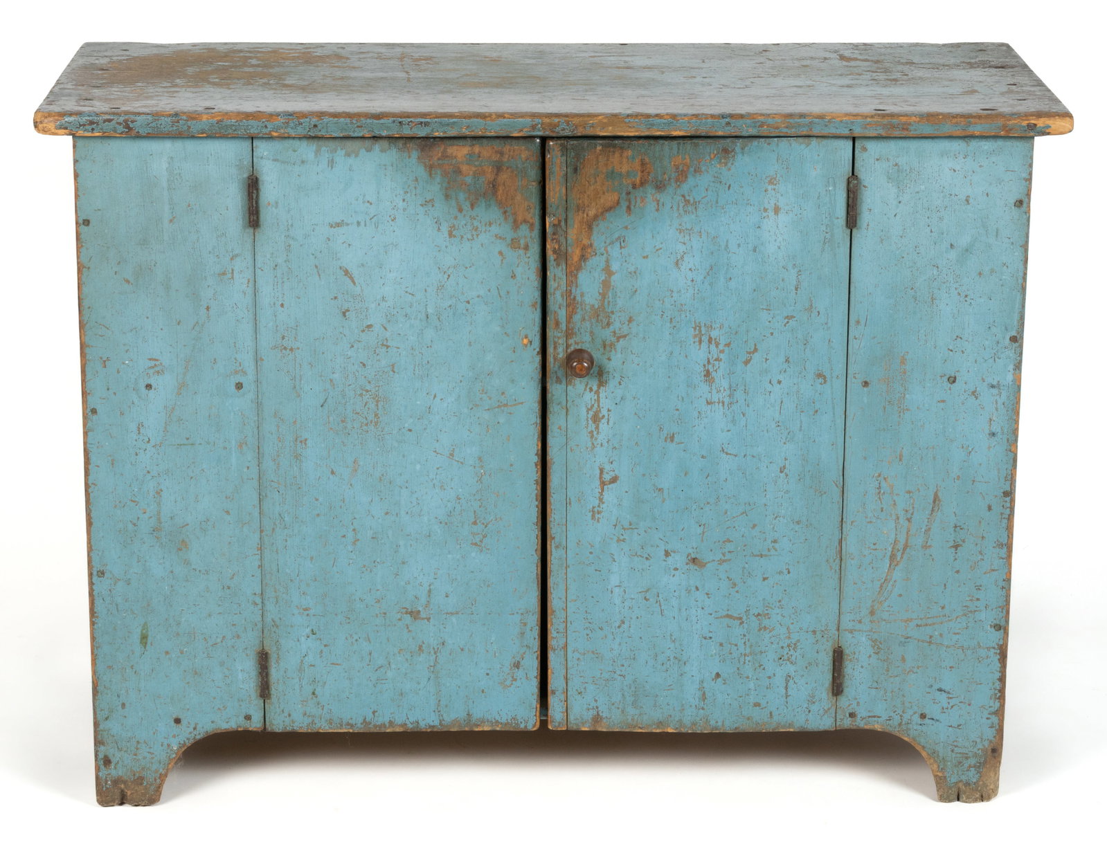 AMERICAN PAINTED POPLAR BENCH CUPBOARD: AMERICAN PAINTED POPLAR BENCH CUPBOARD, diminutive form with plank doors and solid ends terminating in arched cut-outs. Mid 19th century. 28 1/2" H, 39 1/4" W, 16 1/4" D. Provenance: From the private 