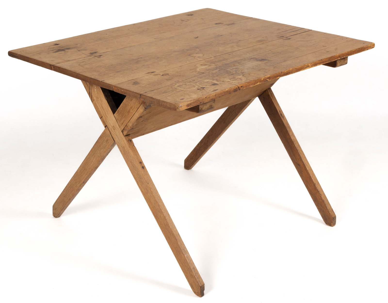 AMERICAN PINE AND OAK SAWBUCK TABLE: AMERICAN PINE AND OAK SAWBUCK TABLE, three-board scrubbed top over typical base, old refinished surface. Mid 19th century. 28" H, 41 1/2" x 33 1/2" top. Provenance: From the private co