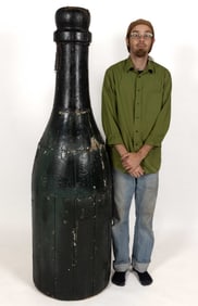 AMERICAN FOLK ART CARVED AND PAINTED WOODEN CHAMPAGNE BOTTLE TRADE SIGN