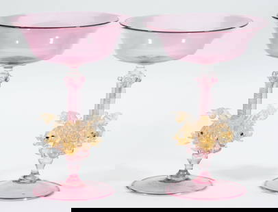 PAIR OF MURANO / VENETIAN ART GLASS FIGURAL DOLPHIN-STEM COMPOTES / TAZZAS: PAIR OF MURANO / VENETIAN ART GLASS FIGURAL DOLPHIN-STEM COMPOTES / TAZZAS, colorless with pale pink casing, each having a wide shallow bowl with flaring rim raised on a complex stem featuring three i