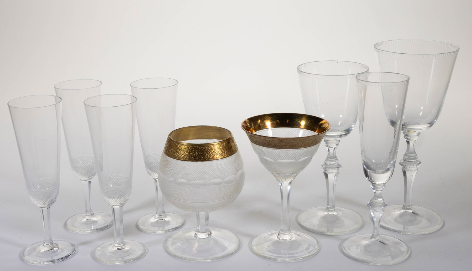 MOSER DRINKING VESSELS, LOT OF NINE: MOSER DRINKING VESSELS, LOT OF NINE, colorless, comprising, a "Splendid" brandy snifter and sherry glass, four "Royal" champagne glasses, a "Mozart" champagne, and two wine glasses, each with acid "Mo