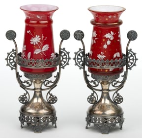 PAIR OF VICTORIAN CASED, GILT, AND ENAMEL-DECORATED GLASS VASES IN QUADRUPLE PLATE STANDS