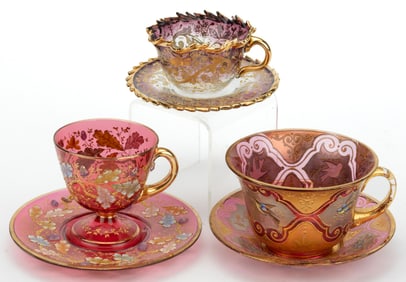 MOSER ATTRIBUTED GILT AND ENAMEL-DECORATED CUP AND SAUCER SETS, LOT OF THREE