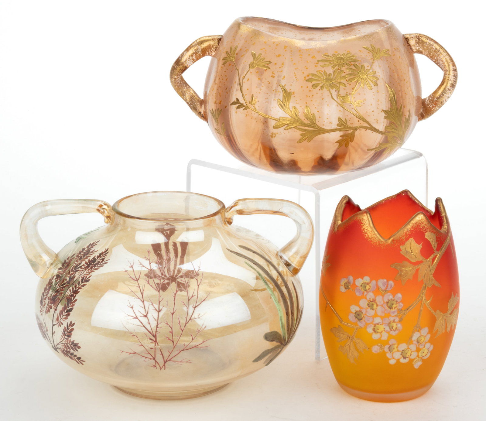 EUROPEAN VICTORIAN ENAMEL-DECORATED GLASS VASES, LOT OF THREE: EUROPEAN VICTORIAN ENAMEL-DECORATED GLASS VASES, LOT OF THREE, comprising an amber mold-blown vase with enamel-decorated aquatic plants, a Panel-Optic molded vase with gold flecking across its exterio