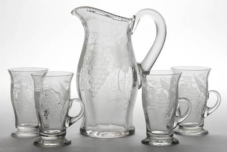 TUTHILL ENGRAVED GLASS ARTICLES, LOT OF FIVE: TUTHILL ENGRAVED GLASS ARTICLES, LOT OF FIVE, comprising a colorless pitcher and four mugs, each with applied handle. Pitcher with polished pontil mark. Tuthill Cut Glass Co. Late 19th/first quarter 2