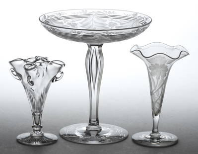 ASSORTED BRILLIANT PERIOD CUT / ENGRAVED GLASS ARTICLES, LOT OF THREE: ASSORTED BRILLIANT PERIOD CUT / ENGRAVED GLASS ARTICLES, LOT OF THREE, colorless lead glass, comprising a tazza/compote with leaf and berry engraving around the shallow bowl which is raised on a cut-p