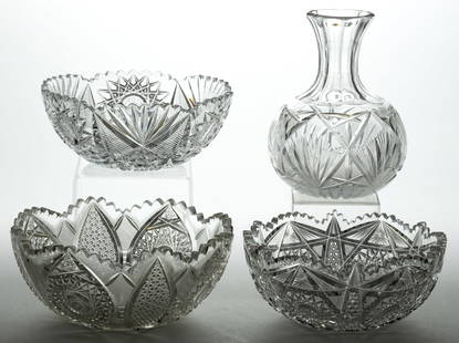 AMERICAN BRILLIANT CUT GLASS TABLE ARTICLES, LOT OF FOUR: AMERICAN BRILLIANT CUT GLASS TABLE ARTICLES, LOT OF FOUR, colorless, comprising three serving bowls and a water bottle, various hobstar, fan, flashed rays, and cane patterns. Late 19th/early 20th cent