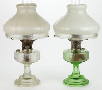 ALADDIN MODEL NO. 104 AND 105 / COLONIAL / HOBNAIL KEROSENE STAND LAMPS, LOT OF TWO: ALADDIN MODEL NO. 104 AND 105 / COLONIAL / HOBNAIL KEROSENE STAND LAMPS, LOT OF TWO, Green Beta Crystal (apple green) and Clear Beta Crystal, circular-form and stepped foot with underside having six o