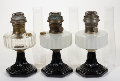 ALADDIN MODELS B-104 AND B-124 / CORINTHIAN KEROSENE STAND LAMPS, LOT OF THREE