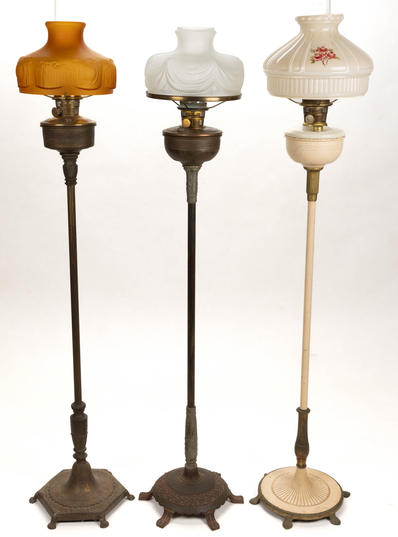 ASSORTED ALADDIN KEROSENE FLOOR LAMPS, LOT OF THREE: ASSORTED ALADDIN KEROSENE FLOOR LAMPS, LOT OF THREE, comprising three floor lamps. A bronze finish cylinder font vase with a plain central pole having a Classical upper and lower connector, leading to