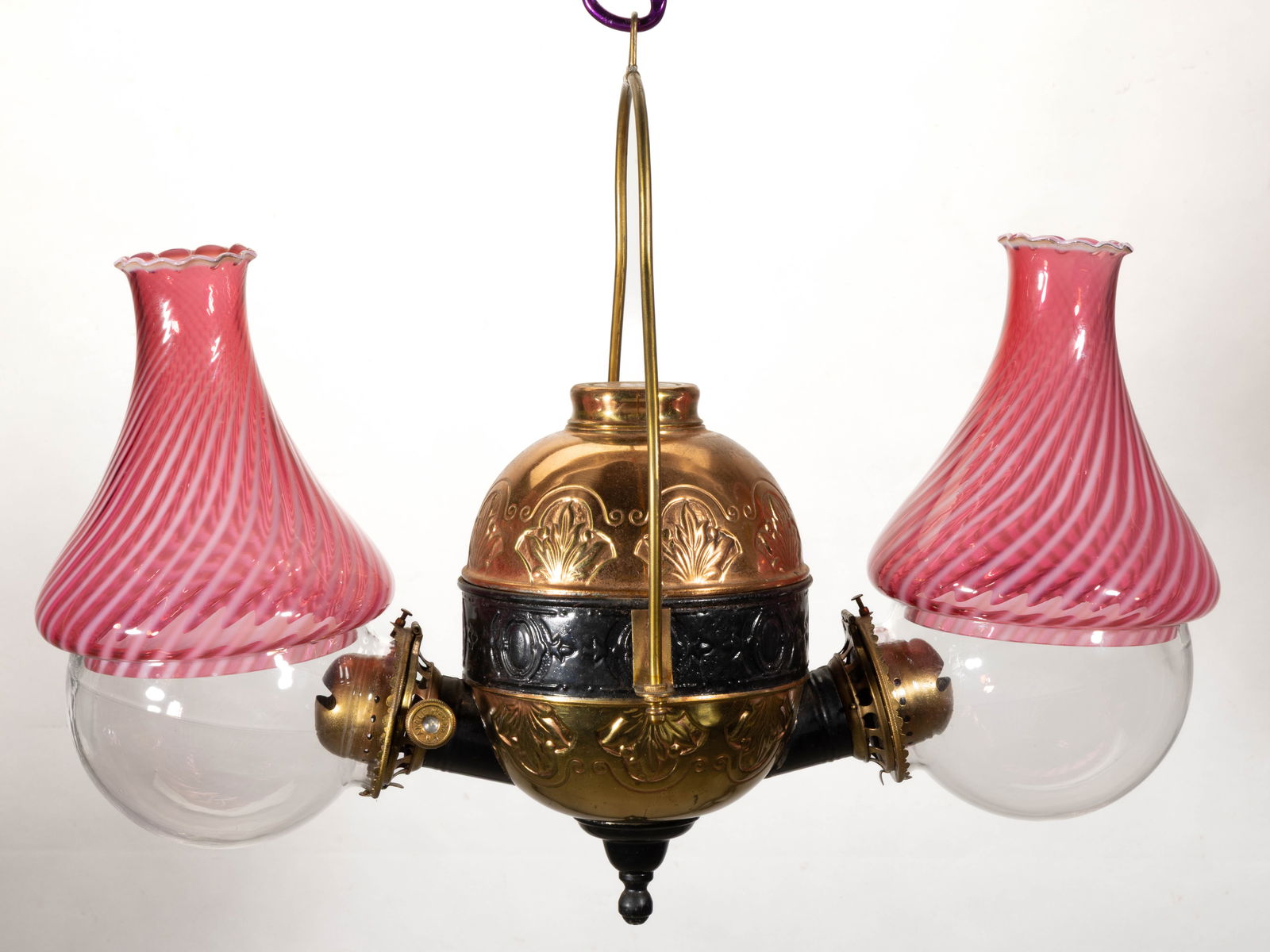 ANGLE LAMP CO. NO. 202 FLEUR-DE-LIS DOUBLE-ARM KEROSENE HANGING LAMP: ANGLE LAMP CO. NO. 202 FLEUR-DE-LIS FOUR-ARM KEROSENE HANGING LAMP, elongated globular-form font with embossed fleur-de-lis pattern, later black paint and copper finish, arch-form hanging arm with hoo
