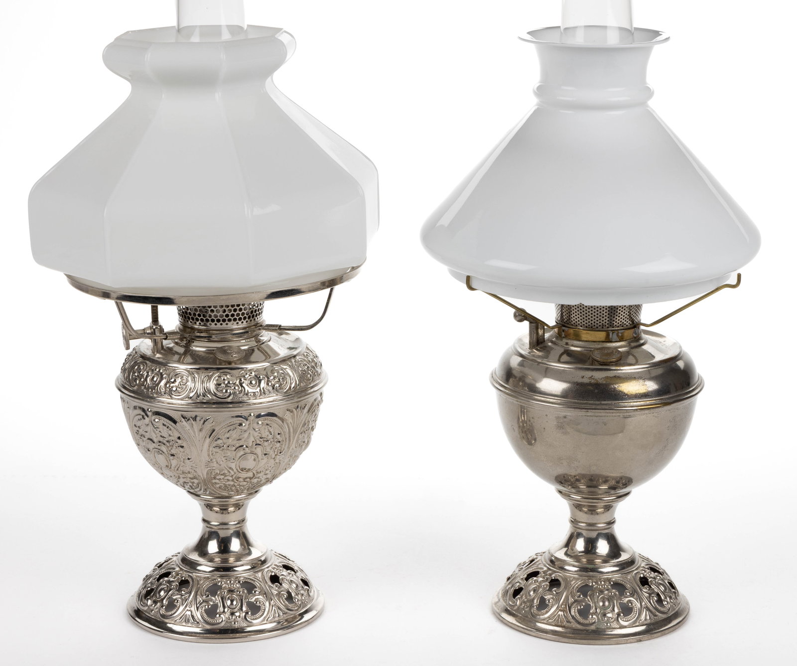 ASSORTED BRADLEY & HUBBARD "JUNIOR NO. 1" KEROSENE CENTRAL-DRAFT STAND LAMPS, LOT OF TWO: ASSORTED BRADLEY & HUBBARD "JUNIOR NO. 1" KEROSENE CENTRAL-DRAFT STAND LAMPS, LOT OF TWO, nickel-plated brass and metal, comprising of one having an unpatterned font and remaining with a scroll and me