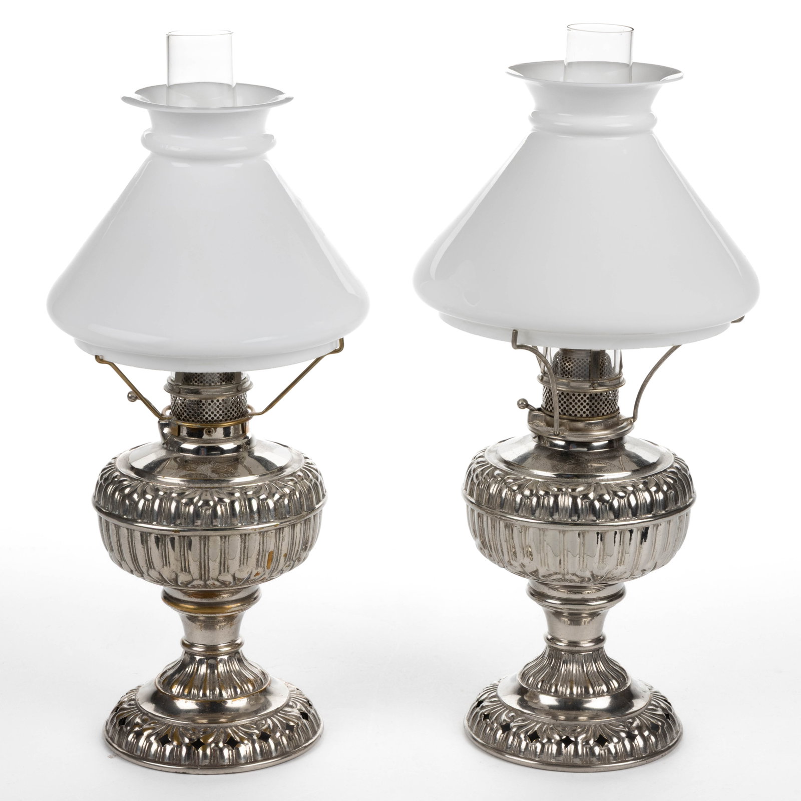 ROCHESTER LAMP CO. "JR ROCHESTER NO. 4" KEROSENE CENTRAL-DRAFT STAND LAMPS, PAIR: ROCHESTER LAMP CO. "JR ROCHESTER NO. 4" KEROSENE CENTRAL-DRAFT STAND LAMPS, PAIR, globular-form fonts with paneled ribbing and short scrolling, each shoulder with a narrow band drip catcher, impressed