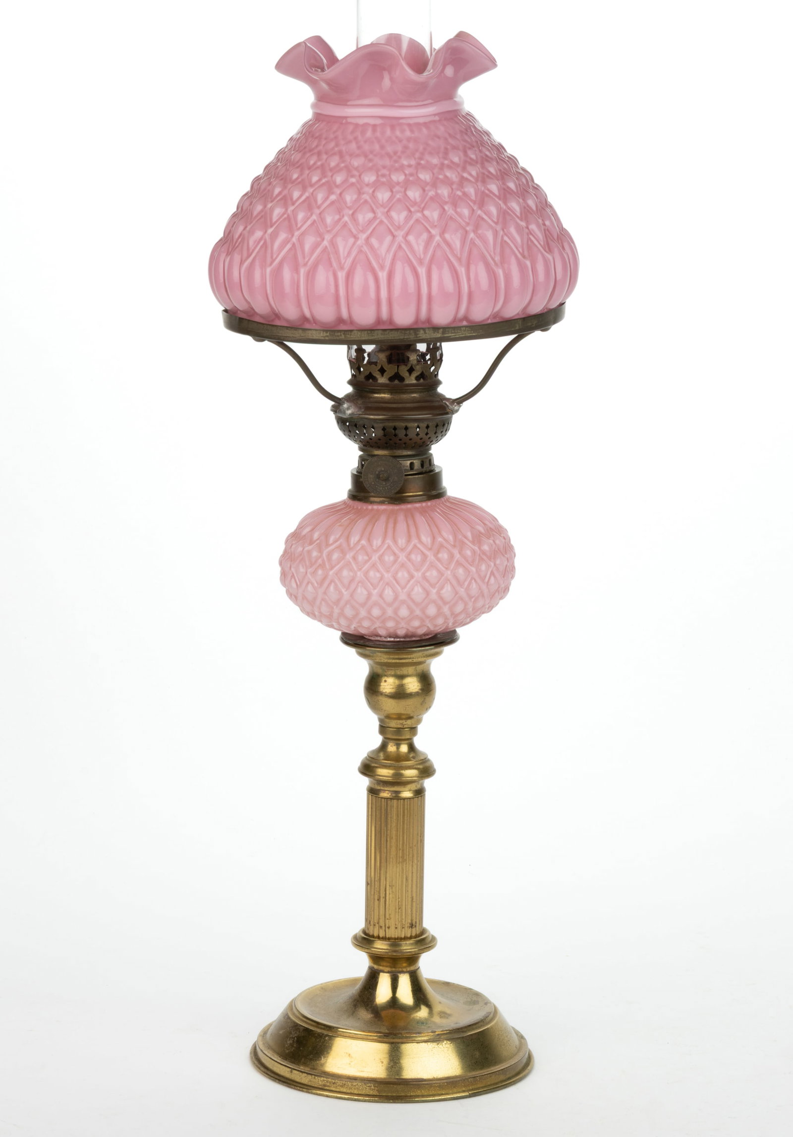 EMBOSSED DIAMOND CASED GLASS MINIATURE BANQUET PEG LAMP: EMBOSSED DIAMOND CASED GLASS MINIATURE BANQUET PEG LAMP, cased light rose/pink, globular-form font, fitted in a brass ribbed baluster-form candlestick base with multi-steps to a circular-form foot wit