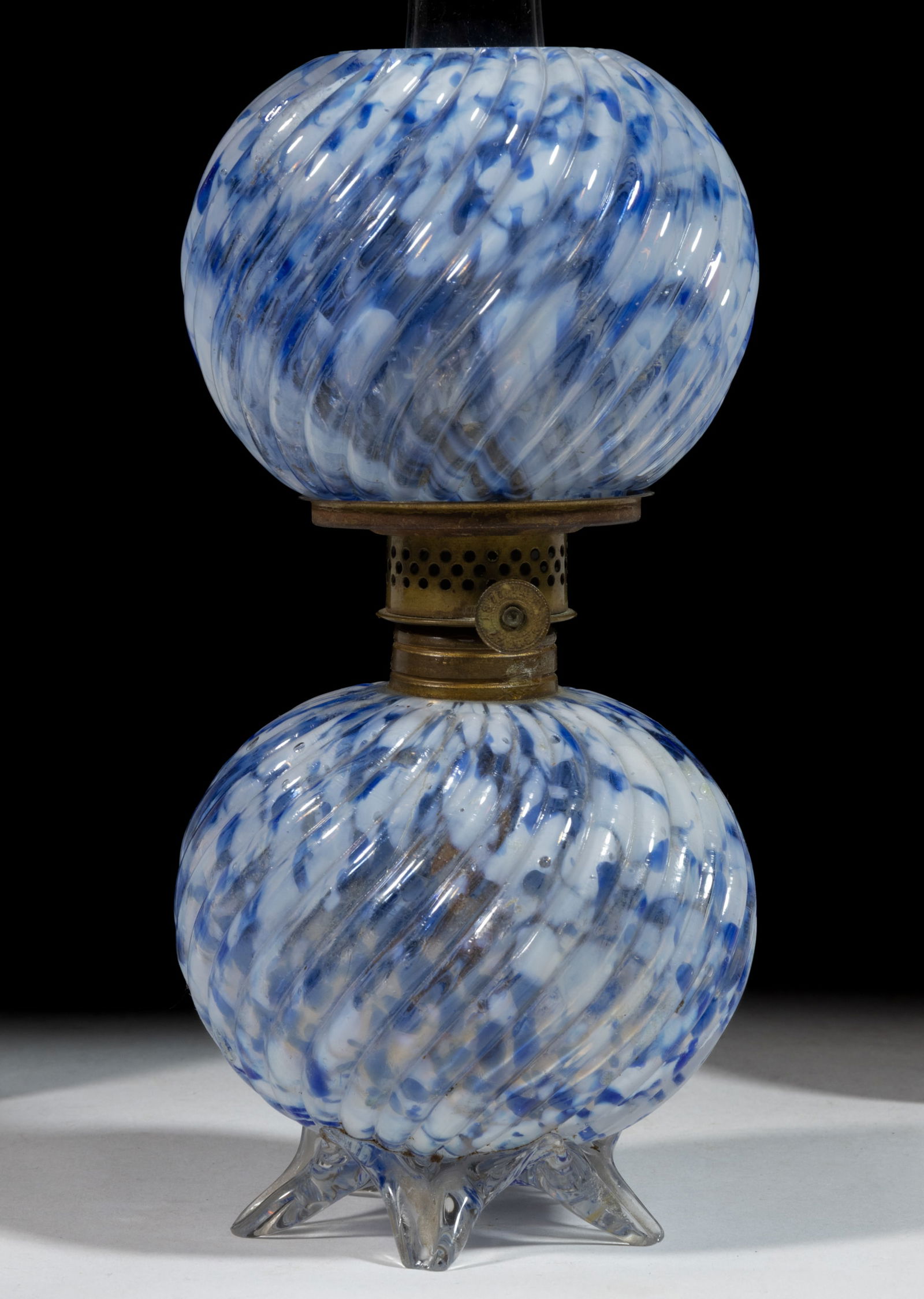 RIBBED SWIRL SPATTER ART GLASS MINIATURE LAMP: RIBBED SWIRL SPATTER ART GLASS MINIATURE LAMP, colorless with opal and multi-tones of blue flakes, ball-form font, colorless applied base with five raised toes, matching patterned ball-form shade, per