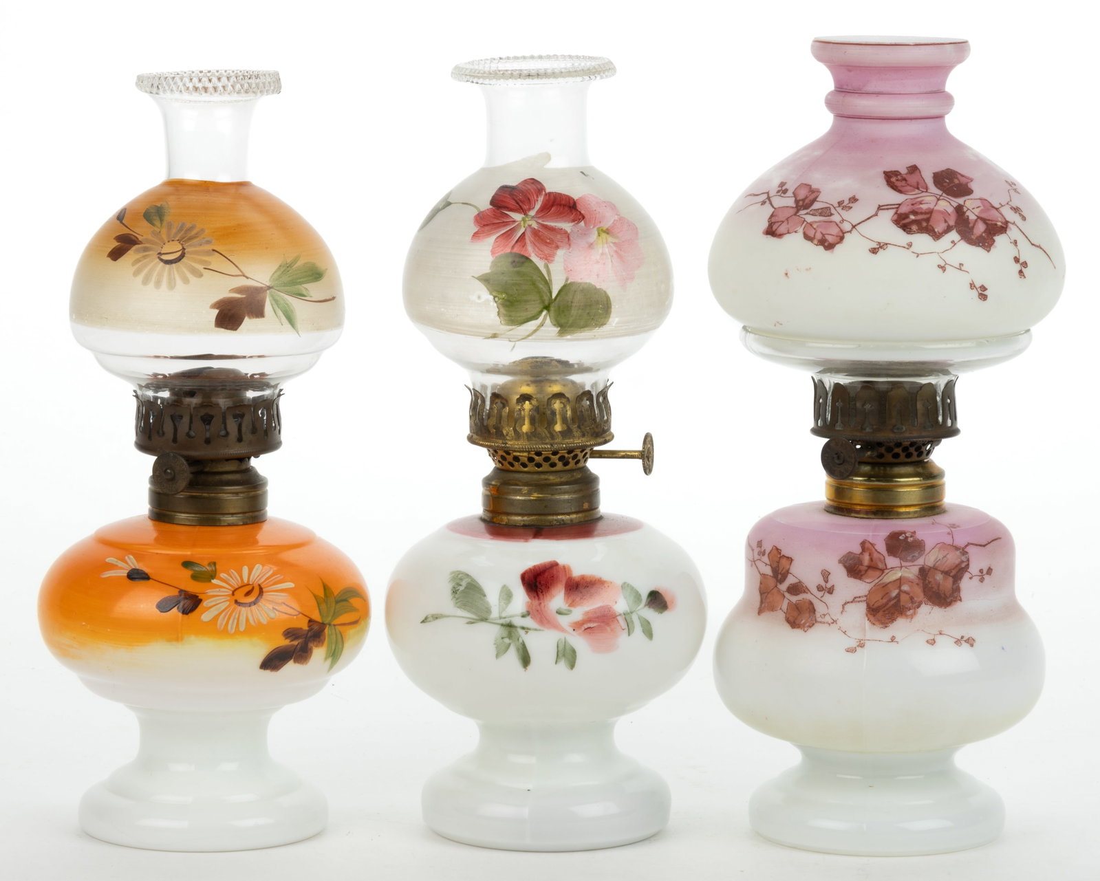 ASSORTED PATTERNED MINIATURE LAMPS, LOT OF THREE: ASSORTED PATTERNED MINIATURE LAMPS, LOT OF THREE, opaque white with various polychrome and transfer decoration, comprising of two Nellie Bly/Smith I, fig. 219 and a Baby Cleveland/Smith I, fig. 218; e