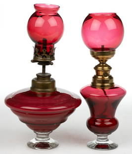 ASSORTED FRENCH ART GLASS MINIATURE STAND / CIGAR LAMPS, LOT OF TWO: ASSORTED FRENCH ART GLASS MINIATURE STAND / CIGAR LAMPS, LOT OF TWO, cranberry, comprising of a compressed conical font molded with beehive-type horizontal rings, colorless applied diminutive circular