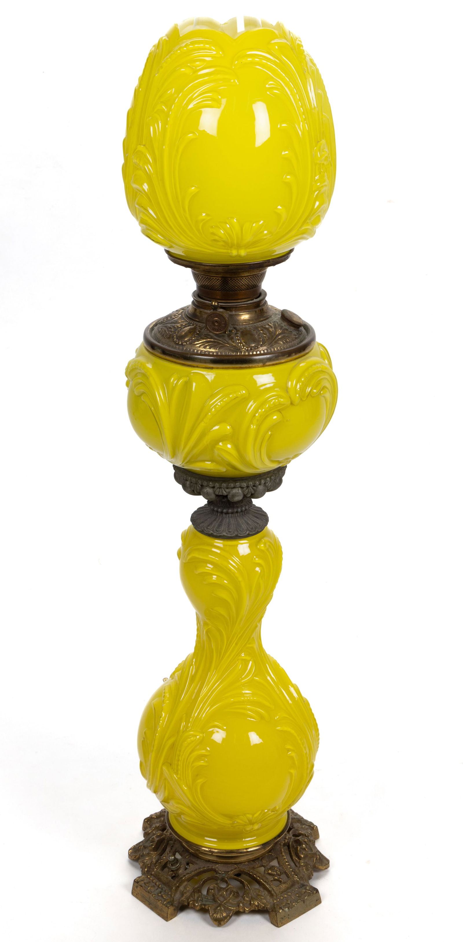 VICTORIAN CASED GLASS KEROSENE BANQUET / PARLOR LAMP: VICTORIAN CASED GLASS KEROSENE BANQUET / PARLOR LAMP, cased lemon yellow, swirling feathers, ribbed swirls and beads embossed pattern, matching pattern ovoid-form shade, cast metal with brass finish c