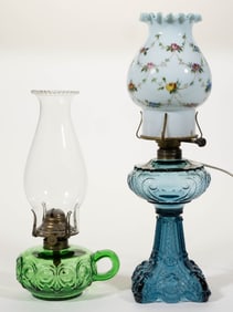 ASSORTED PATTERNED AND COLORED GLASS KEROSENE LAMPS, LOT OF TWO