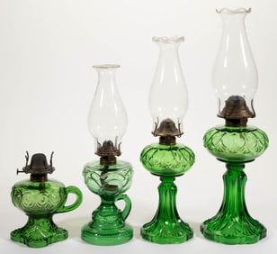 ASSORTED PATTERNED KEROSENE LAMPS, LOT OF FOUR