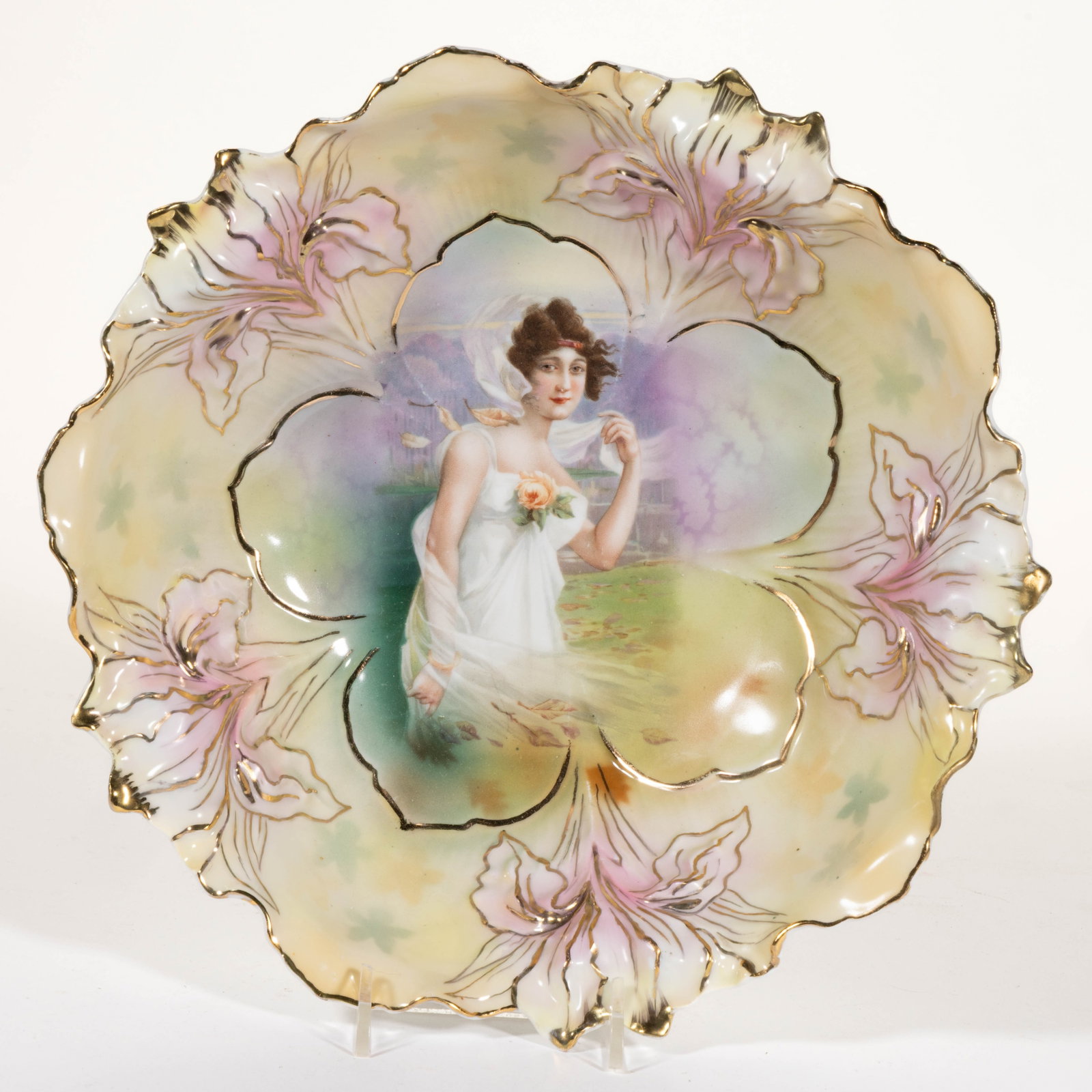 R.S. PRUSSIA PORCELAIN AUTUMN SEASON PORTRAIT BOWL: R.S. PRUSSIA PORCELAIN AUTUMN SEASON PORTRAIT BOWL, RSP Mold 25, featuring beautiful polychrome transfer image of a windblown young woman wearing a scarf with swirling leaves on yellow ground, shadow 