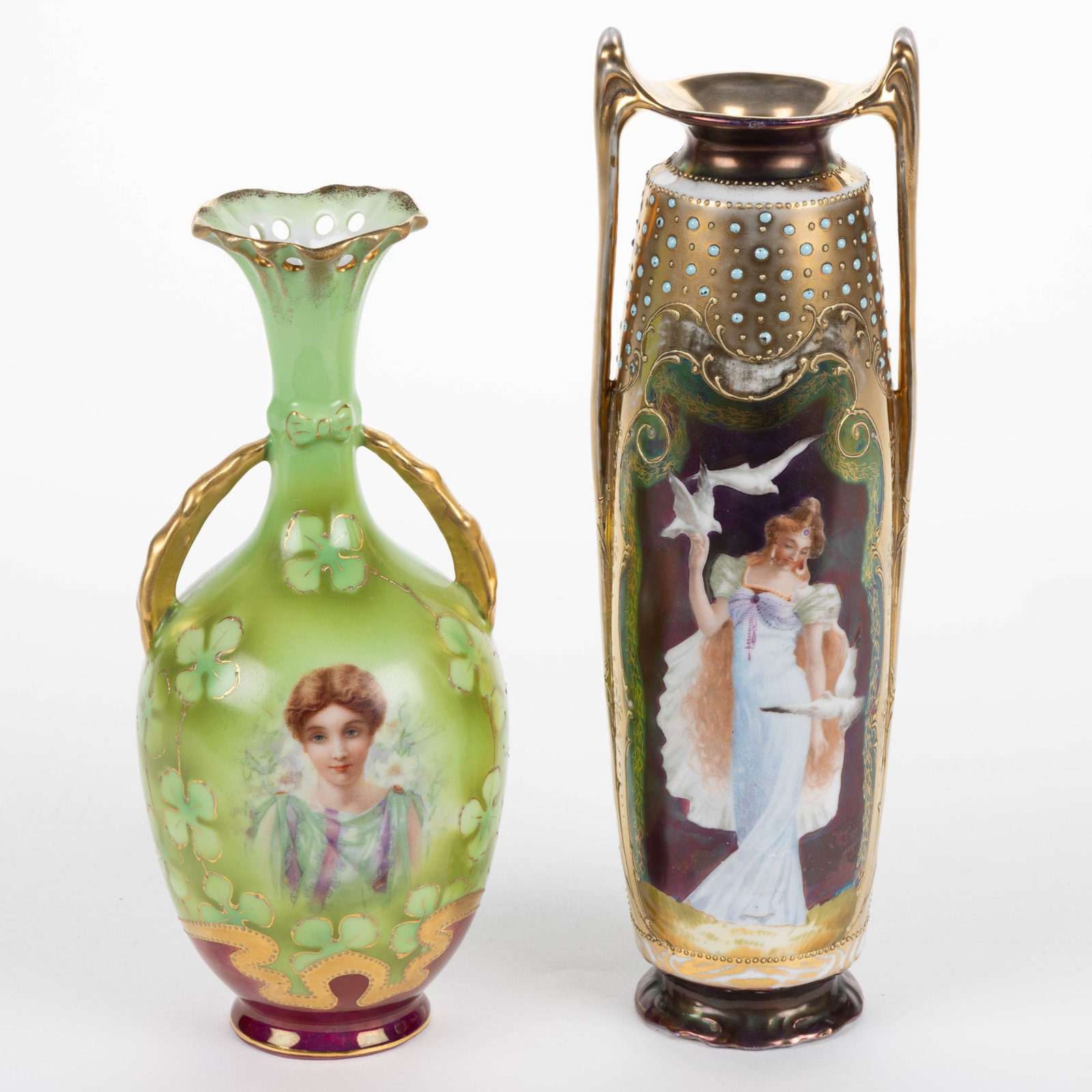 GERMAN PORCELAIN ART NOUVEAU WOMAN MOTIF VASES, LOT OF TWO: GERMAN PORCELAIN ART NOUVEAU WOMAN MOTIF VASES, LOT OF TWO, comprising one example featuring images including Woman with Peacock and Lady with Doves on Tiffany finish ground and having additional appl