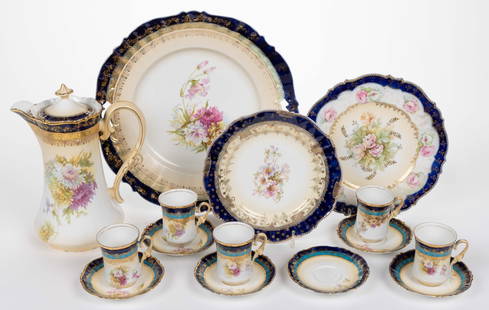 R.S. PRUSSIA-STYLE PORCELAIN COBALT-DECORATED CHOCOLATE AND TABLE ARTICLES, LOT OF 15: R.S. PRUSSIA-STYLE PORCELAIN COBALT-DECORATED FLORAL MOTIF CHOCOLATE AND TABLE ARTICLES, LOT OF 15, each having gilt accents and polychrome transfer images, comprising a RSP Mold 343 12-piece partial