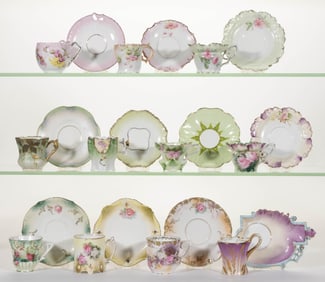R.S. PRUSSIA AND OTHER PORCELAIN FLORAL MOTIF DEMITASSE CUP AND SAUCER SETS, LOT OF 11