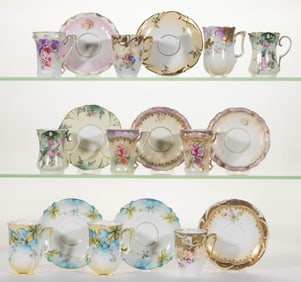 R.S. PRUSSIA / GERMANY PORCELAIN FLORAL MOTIF CHOCOLATE CUPS AND SAUCERS, LOT OF 18