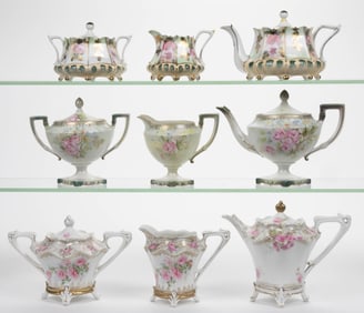 R.S. PRUSSIA PORCELAIN FLORAL MOTIF THREE-PIECE TEA SETS, LOT OF THREE